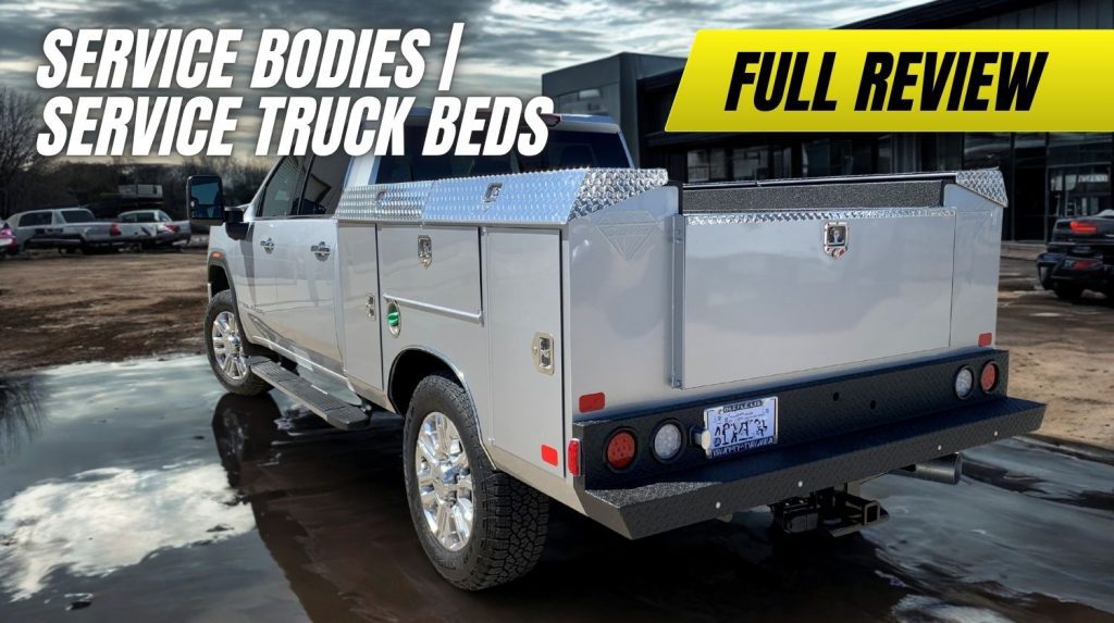 Steel service body truck bed with side compartments, ladder rack, and rear step bumper—mounted on a Ford F-350 for professional work use.