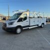 Ford E-Transit Custom Service Body with compartments, shelving, and 1300 lb lift gate