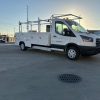 Ford E-Transit Custom Service Body with compartments, shelving, and 1300 lb lift gate