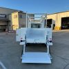 Ford E-Transit Custom Service Body with compartments, shelving, and 1300 lb lift gate
