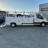 Ford E-Transit Custom Service Body with compartments, shelving, and 1300 lb lift gate