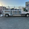 Ford E-Transit Custom Service Body with compartments, shelving, and 1300 lb lift gate