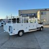 Ford E-Transit Custom Service Body with compartments, shelving, and 1300 lb lift gate