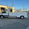 Ford E-Transit Custom Service Body with compartments, shelving, and 1300 lb lift gate