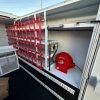 Ford F-550 service body superstructure shelves with custom cargo netting and spray-can baskets