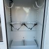 Ford F-550 service body welding bottle brackets with reinforced diamond-plate floor and hose J-hook