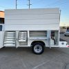 Ford F-550 service body rear platform with 16" work deck, straight step bumper, Class V receiver hitch