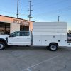 Ford F-550 service body with 11' Diamond body and 50" superstructure, painted white, driver-side view