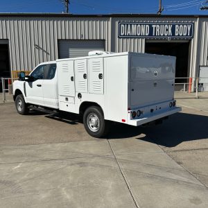 8-foot Diamond Animal Transport Body installed on a Ford F-250 Super Cab chassis, painted white and designed for county animal control use.”