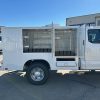 8-foot Diamond Animal Transport Body installed on a Ford F-250 Super Cab chassis, painted white and designed for county animal control use.”