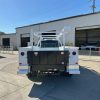 9-foot Diamond service body mounted on a 2026 Ford F-450 60-inch CA chassis, painted white with open-top compartments and aluminum diamond overlay lids.”