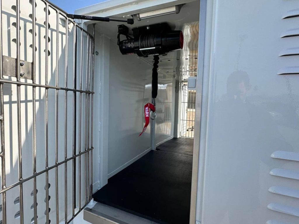 Warn winch animal control body compartment