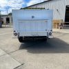 Animal transport truck body rear view with step bumper and cage doors