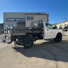 Steel flatbed truck body with hardwood deck on Ram 2500 work truck
