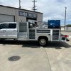 Crane service truck body on Ford F-450 with reinforced crane compartment and work platform