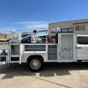 11 foot crane service body with compartments and storage system