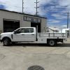 Ford F-350 flatbed with 1,600 lb Tommy Gate liftgate